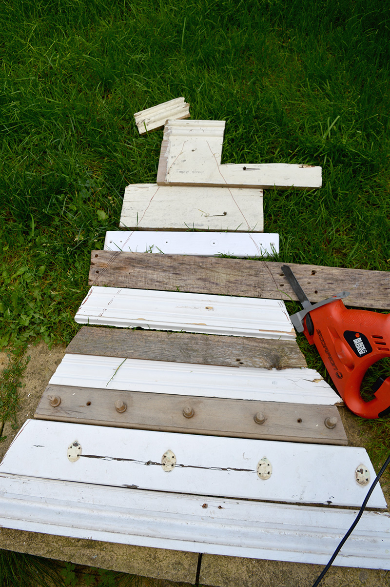 Laying out the design of a DIY wood Christmas tree.