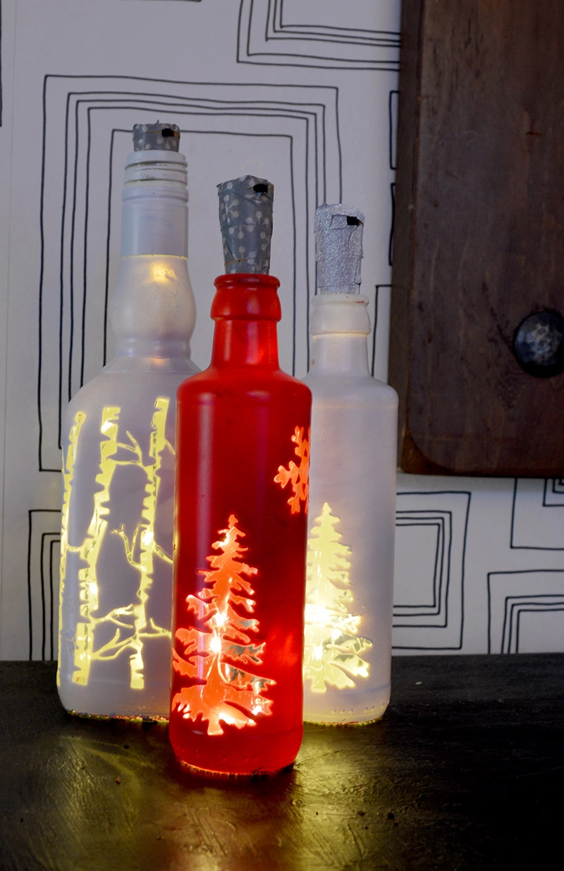 Illuminate your home at Christmas with this simple Christmas bottle lights.  They would also make a lovely Christmas gift. #Christmas #Christmascrafts #Christmaslights #bottlelights #lights