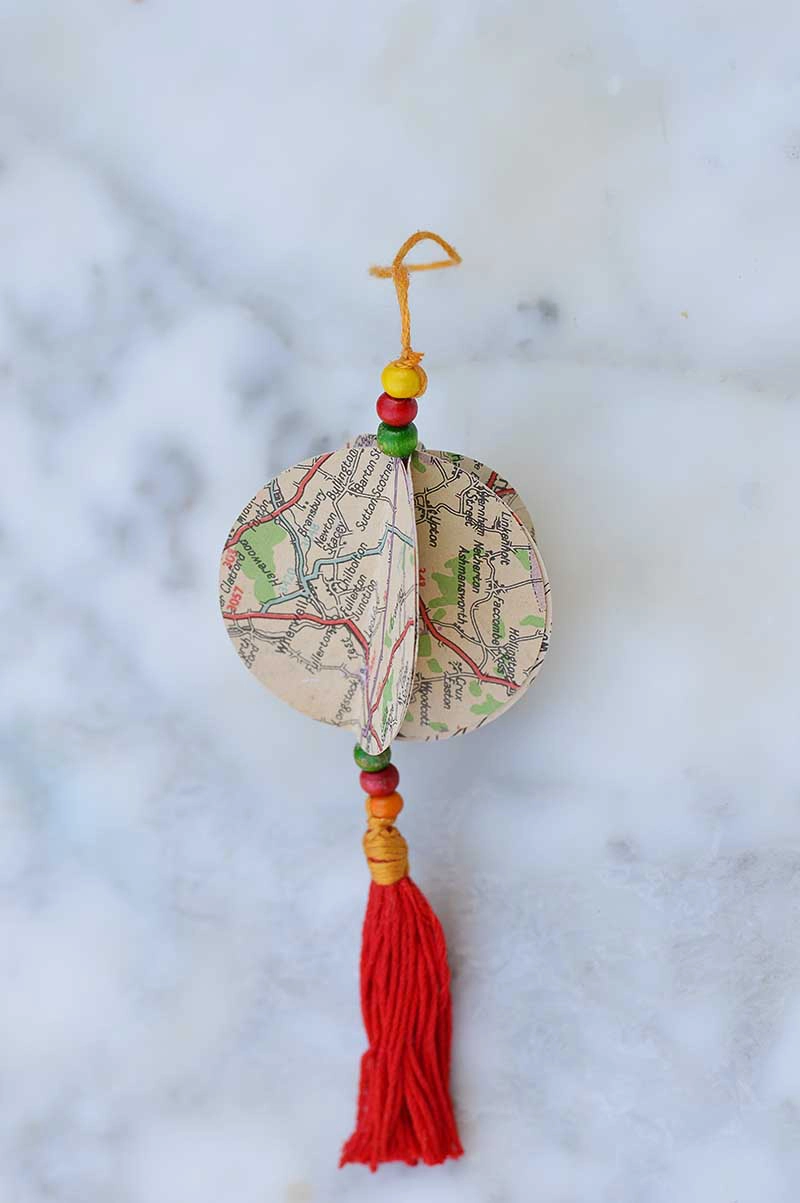  map Christmas ornament complete with tassel.