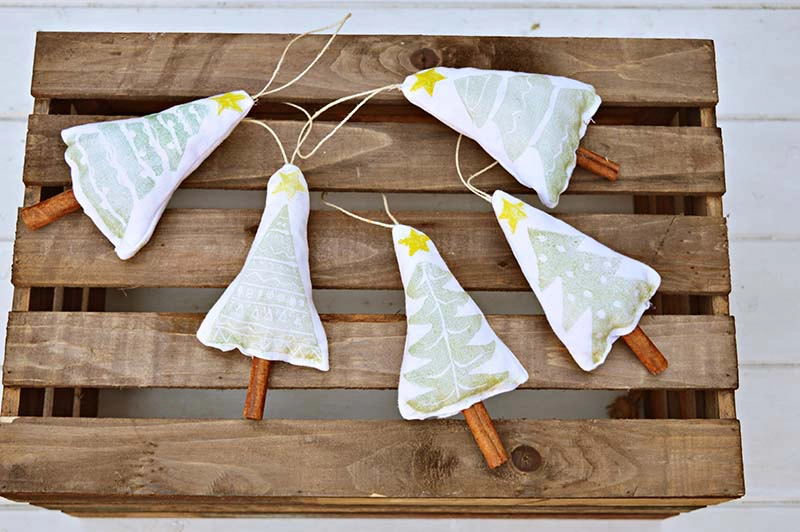 Make your own Christmas tree stamp to make some lovely Christmas decorations.