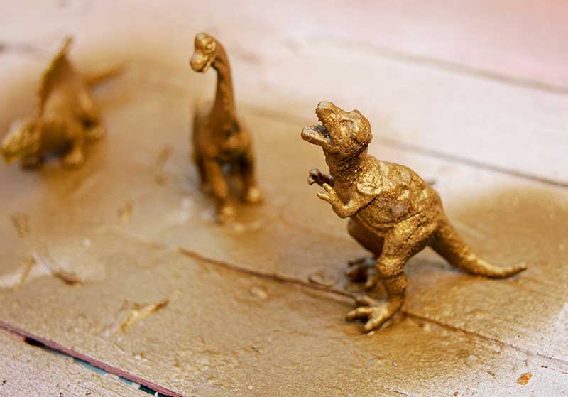 Gold spray painted dinosaur