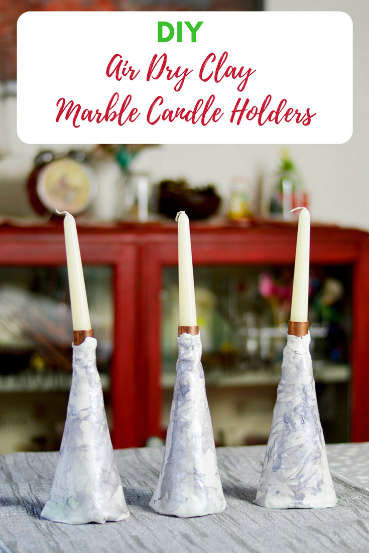 Create a beautiful centerpiece for your Christmas dining table or an extra decoration for your mantle with an easy to make marble air dry candle holder. #candleholder #airdryclay #claycandleholder #marble