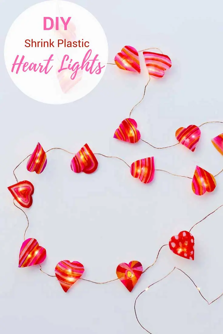 Brighten up your home for Valentine's day with these DIY heart string lights.  Made with shrink plastic and sharpies.  #sharpiescraft #valentinescraft #valentinesday #valentinesdecor #stringlights.