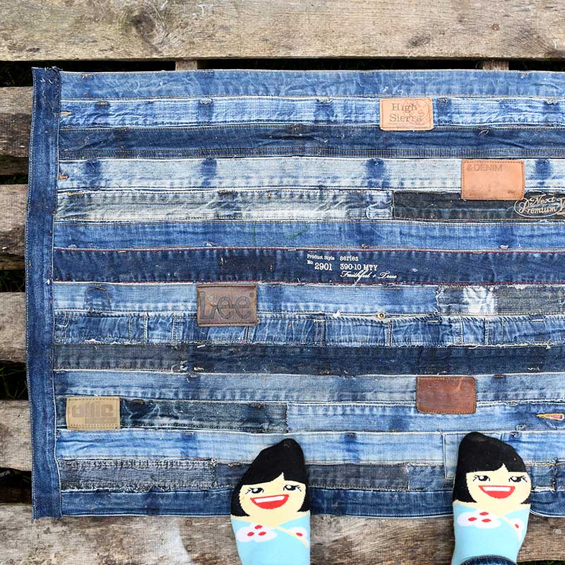 Tutorial for a DIY denim rug made from repurposed jeans waistband- Ikea hack no sewing.