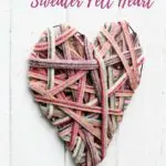 Recycle sweaters into a cute heart decoration for your wall for Valentine's. A simple, cheap upcycling craft. #recyclesweaters #sweaterfelt #heartdecoration #valentinescraft #valentinedecoarion