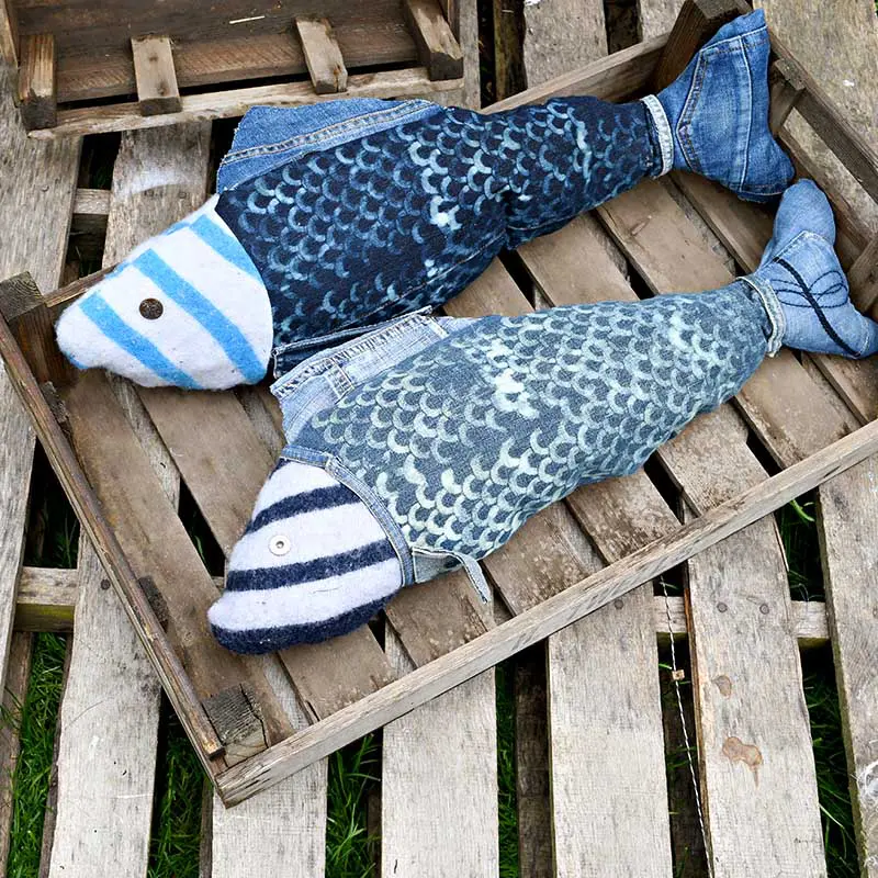 Make a fun and unique repurposed denim fish pillow for your home. Complete with bleached denim scales. Very simple to make, full step by step tutorial with a free pattern included. #diypillow #nauticalcrafts #summercrafts
