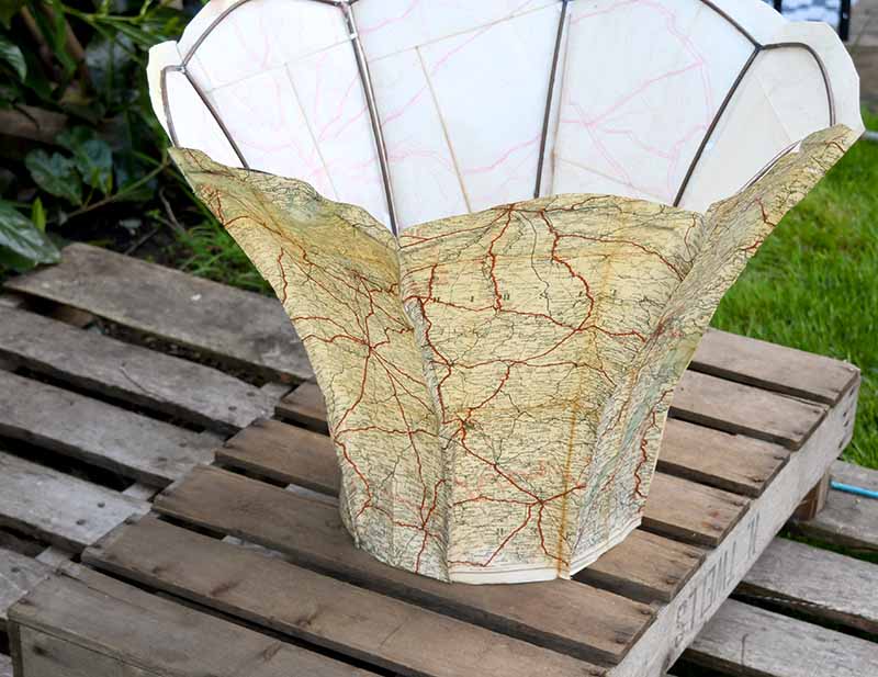 Recovering a scalloped lampshade with vintage maps