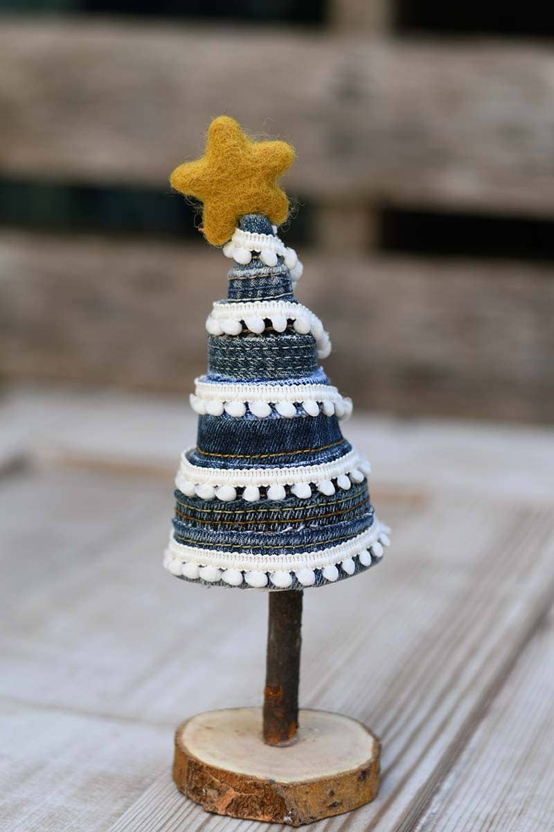 pom pom decorated DIY denim Christmas tree.