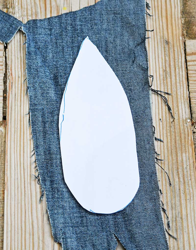 Feather template on denim scrap