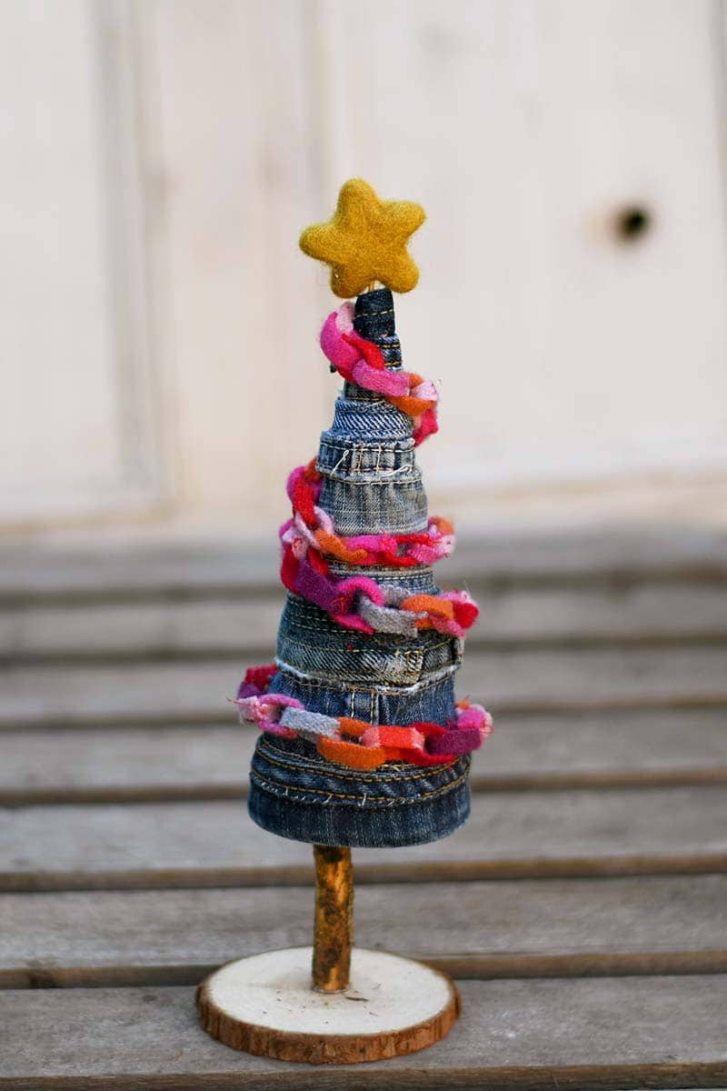 Upcycled denim Christmas tree with mini upcycled scrap felt garland.