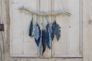 Denim feather wall decor