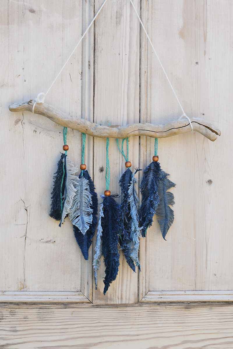 Denim feather wall decor