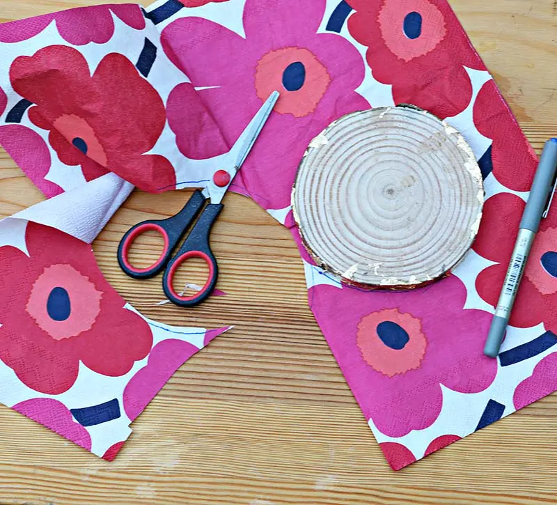 Cutting Marimekko napkin for decoupage.