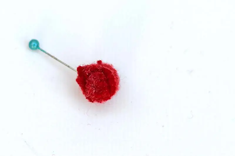 rolled tiny felt rose