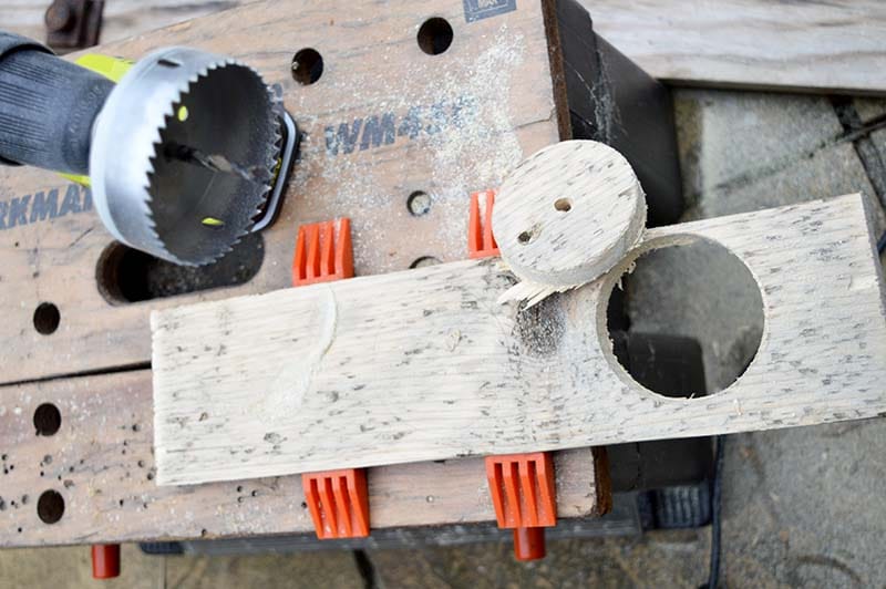 Drilling a hole in the bud vase tray with hole saw