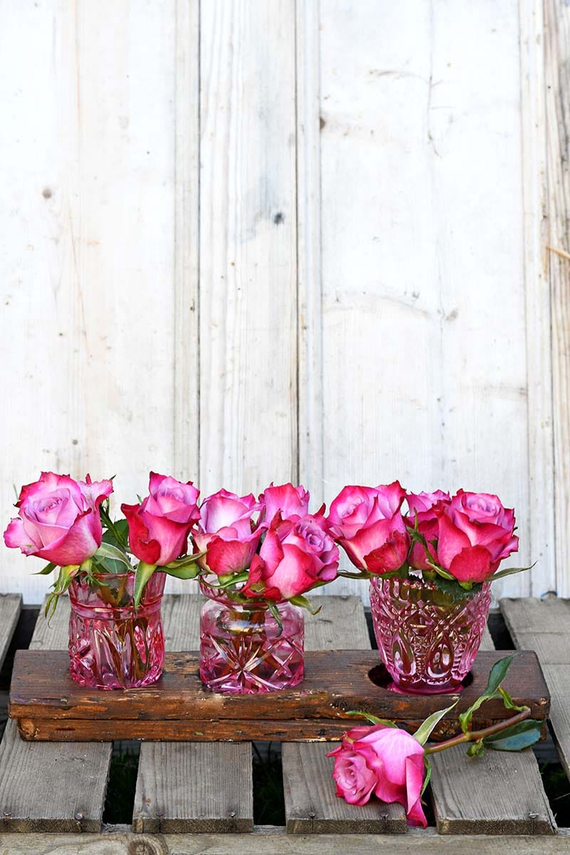 Hand painted coloured glass bud vases