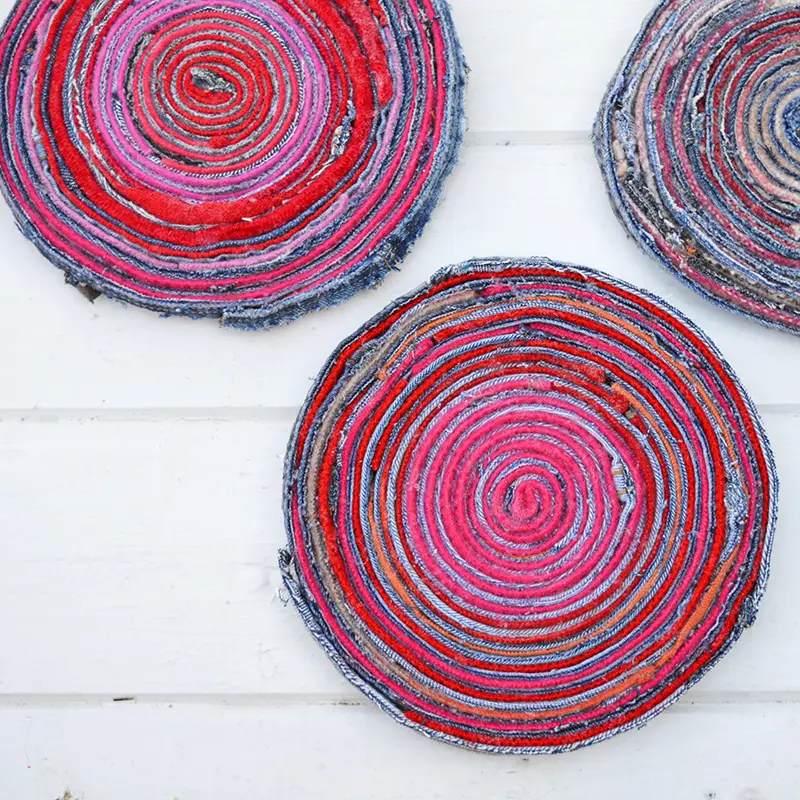 Upcycled fabric placemats made with denim and wool scraps.