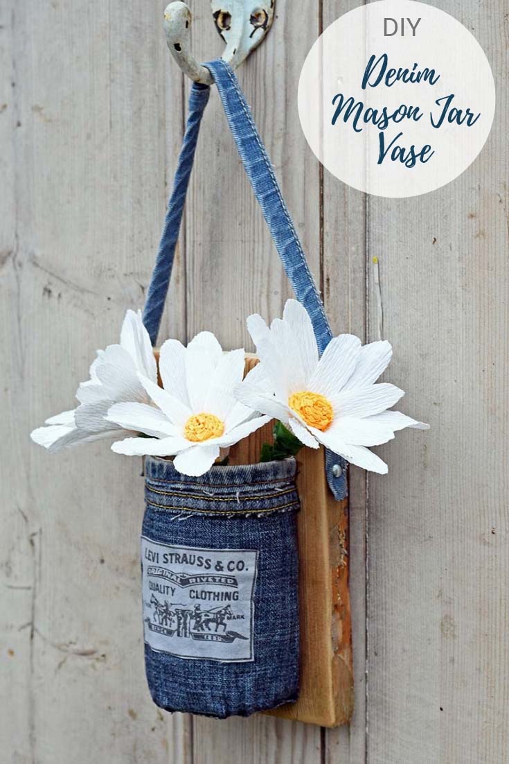 Denim mason jar vase with paper daisies.