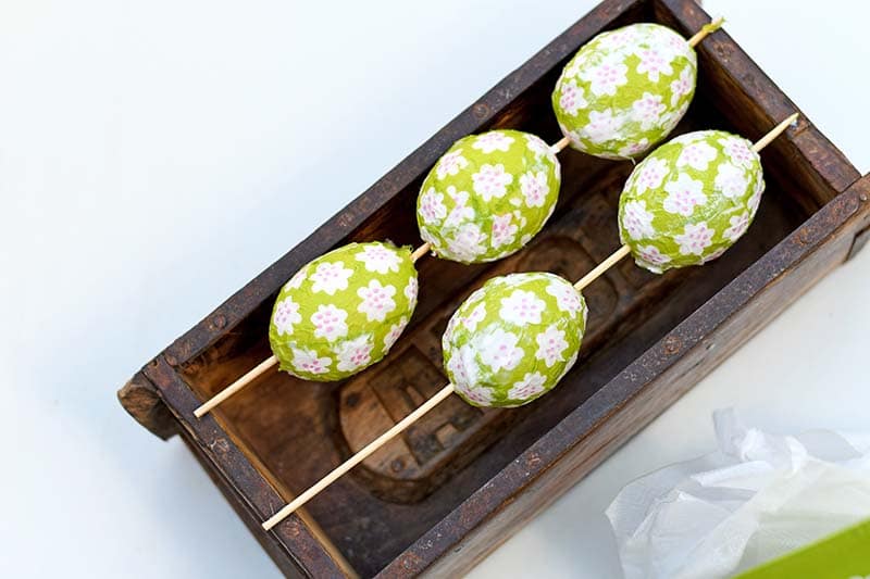 Drying decoupage eggs.