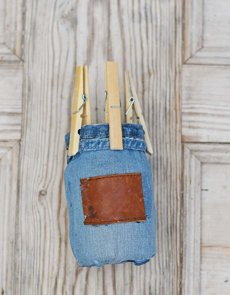 gluing  the denim to the paper mason jar vase