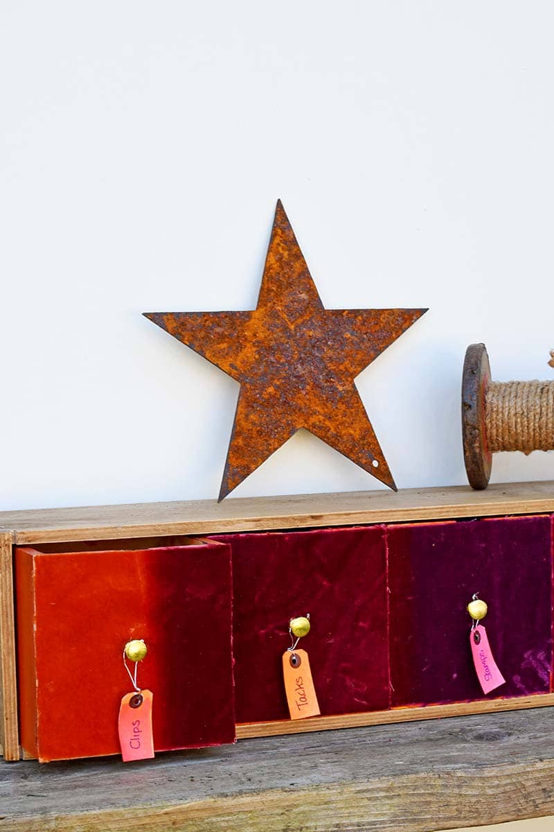 Close up of velvet small wooden drawers