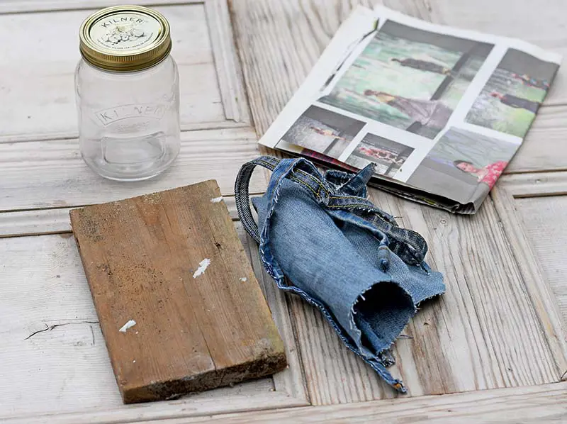 mason jar, wood, denim scraps and newspaper