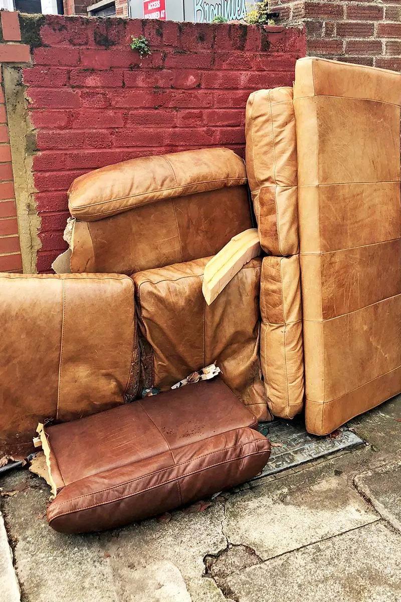 Discarded sofa source of leather