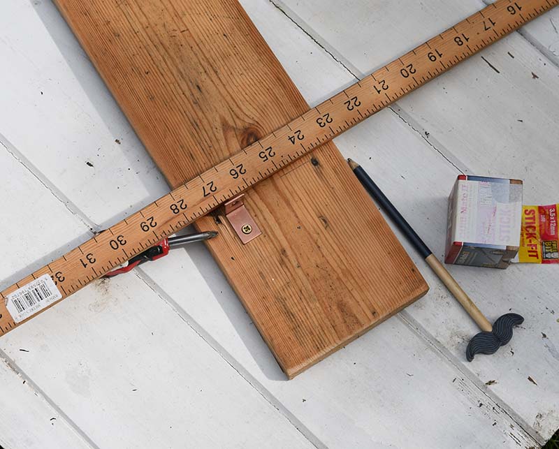 measuring for natural wood shelf placement