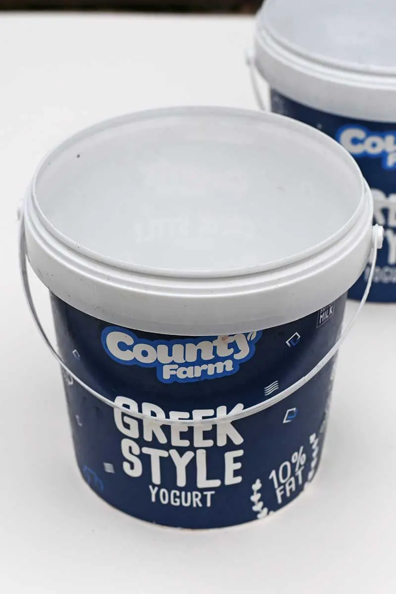 empty Greek yogurt bucket