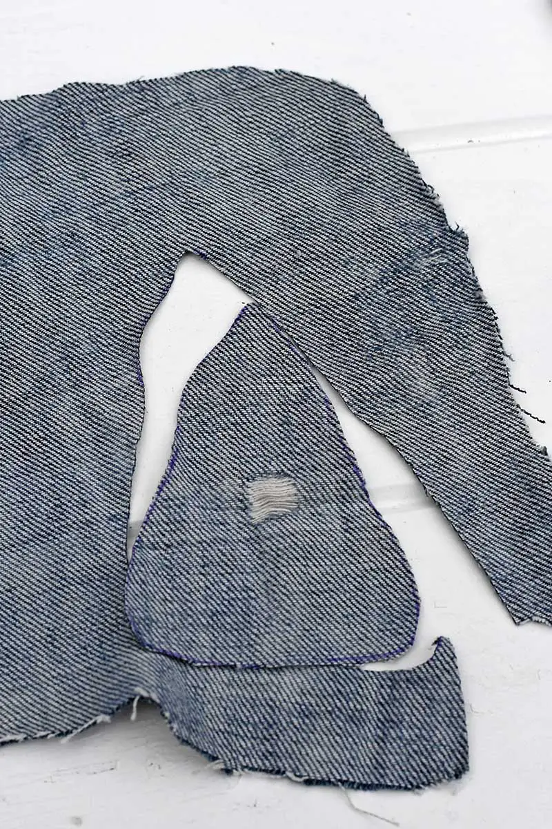 cutting out the denim shape