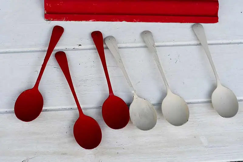 Painted red and cream spoons