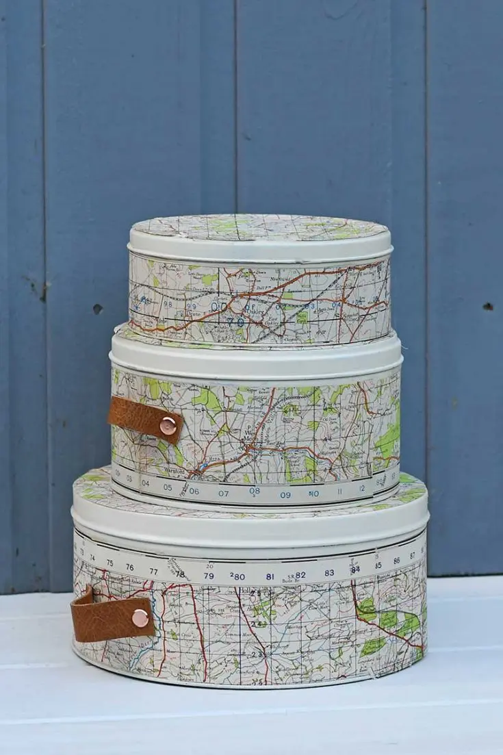 empty cookie tins upcycled with maps