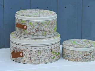 Repurposed map cookie tins