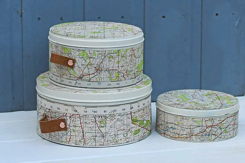 Repurposed map cookie tins