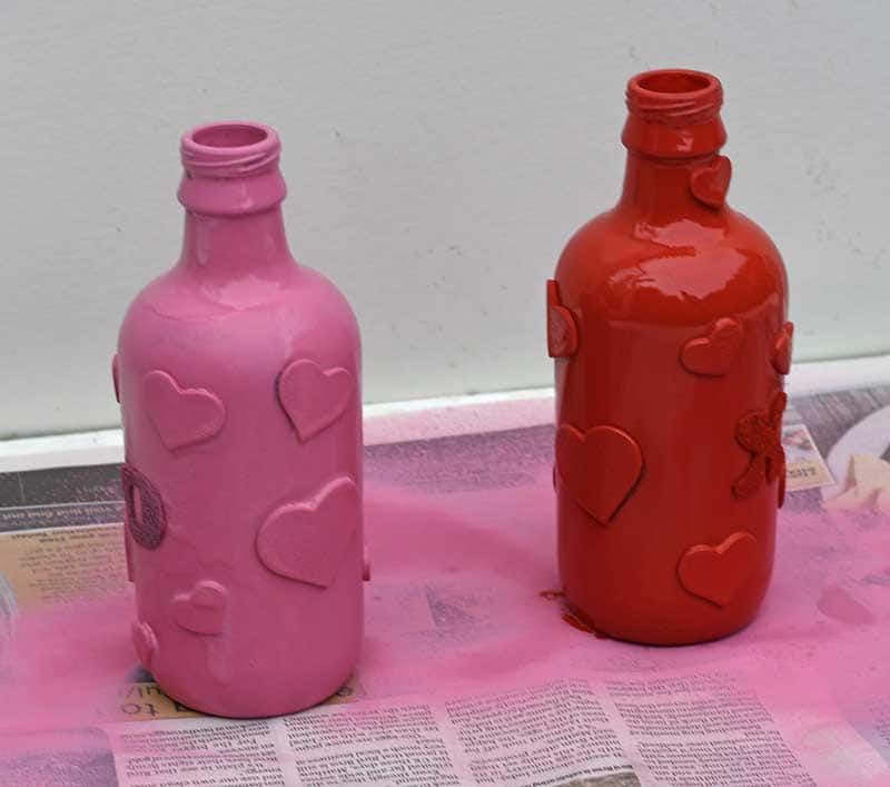 spray painting the Valentine's bottle