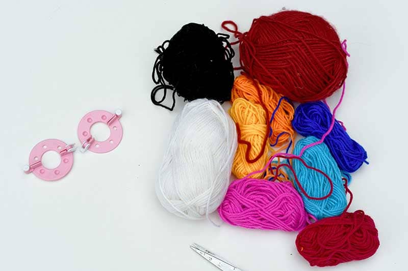 assorted yarn and pom pom maker