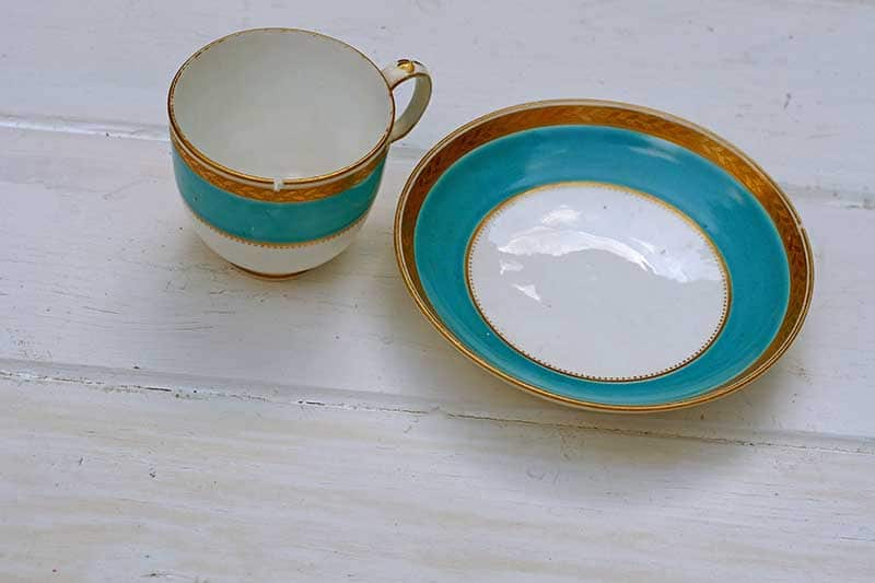 Chipped cup and saucer