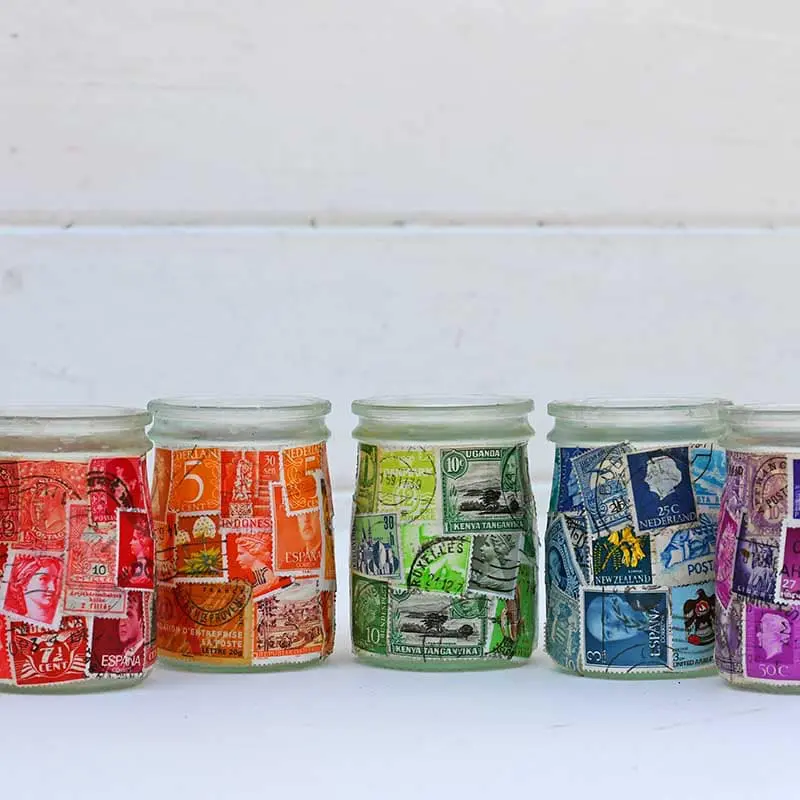 A rainbow of postage stamp decoupage jars