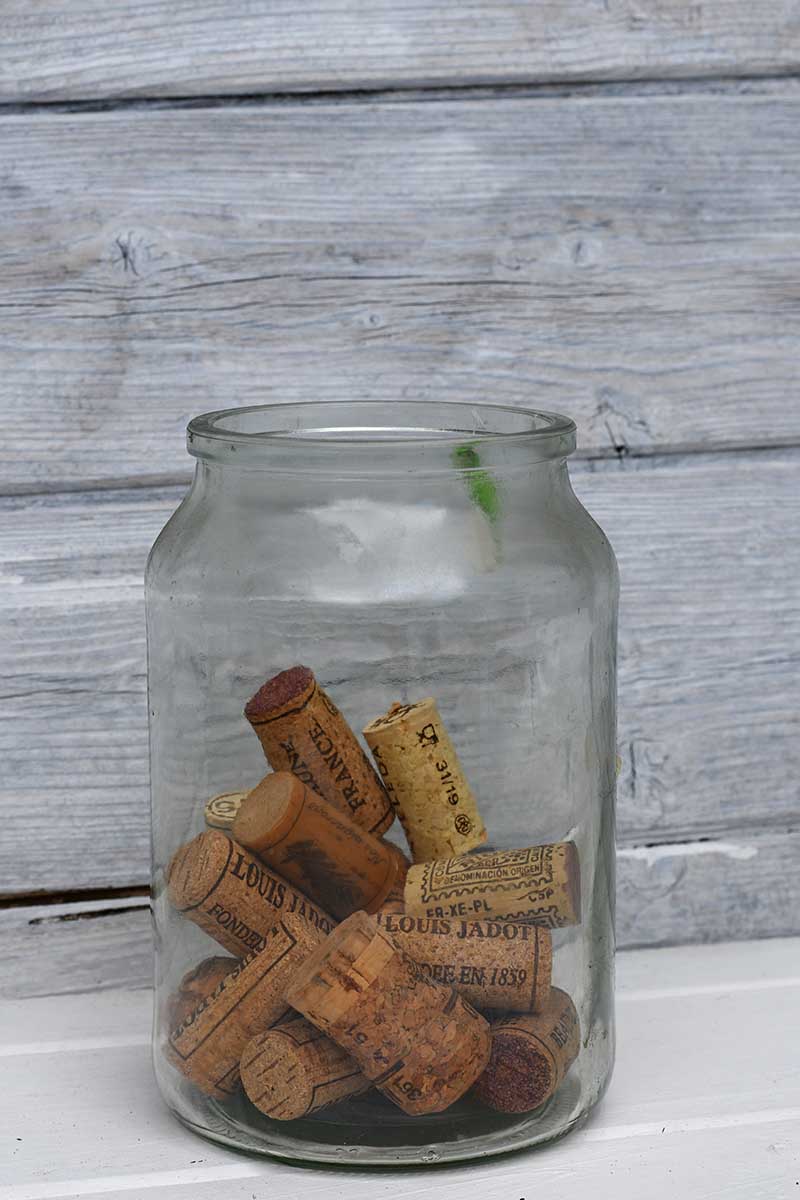 A glass jar of old wine corks