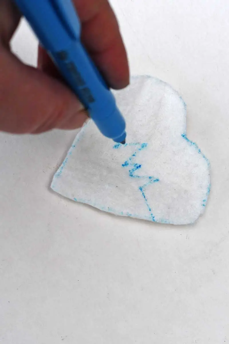 drawing the pattern on the felt heart