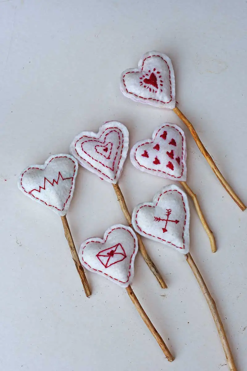 Embroidered Scandi hearts for a mantle decoration