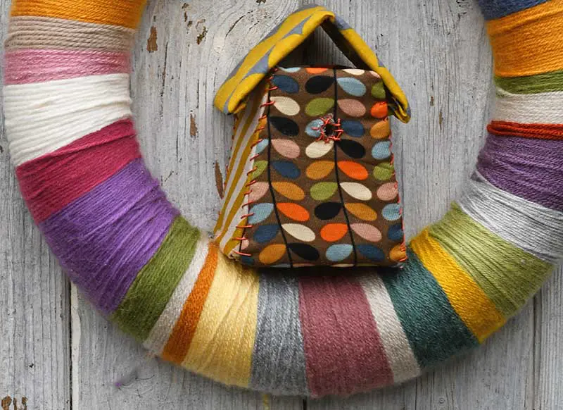 Adding bird house to DIY yarn wreath