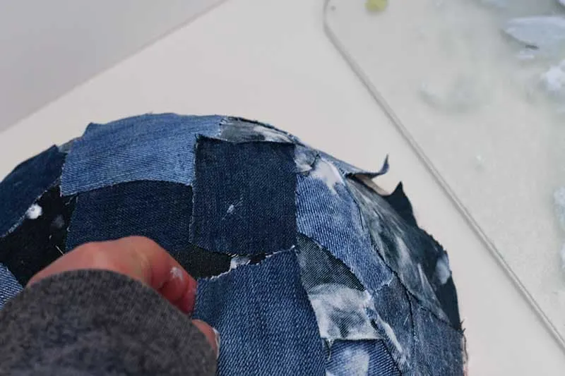 Adding more denim squares.