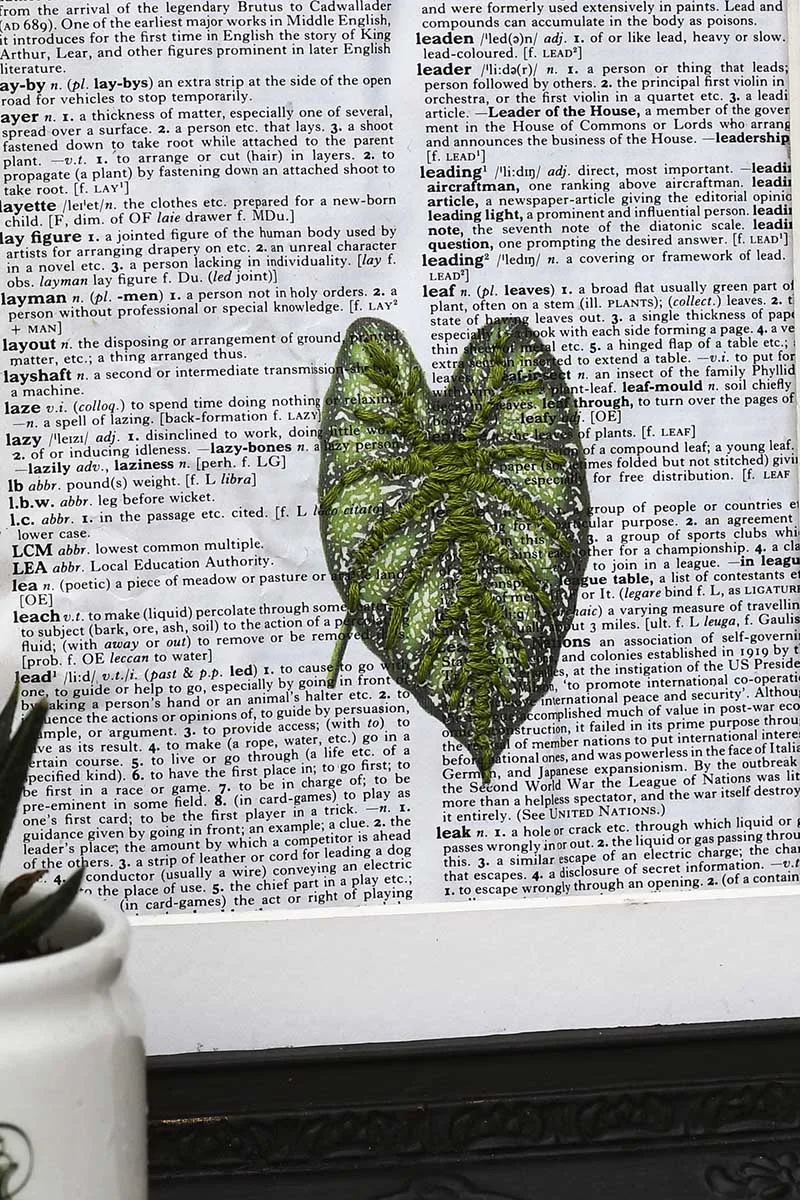 leaf embroidered on paper
