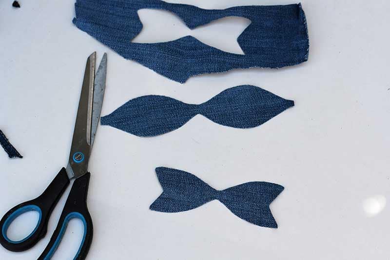 Cutting out denim bow shapes