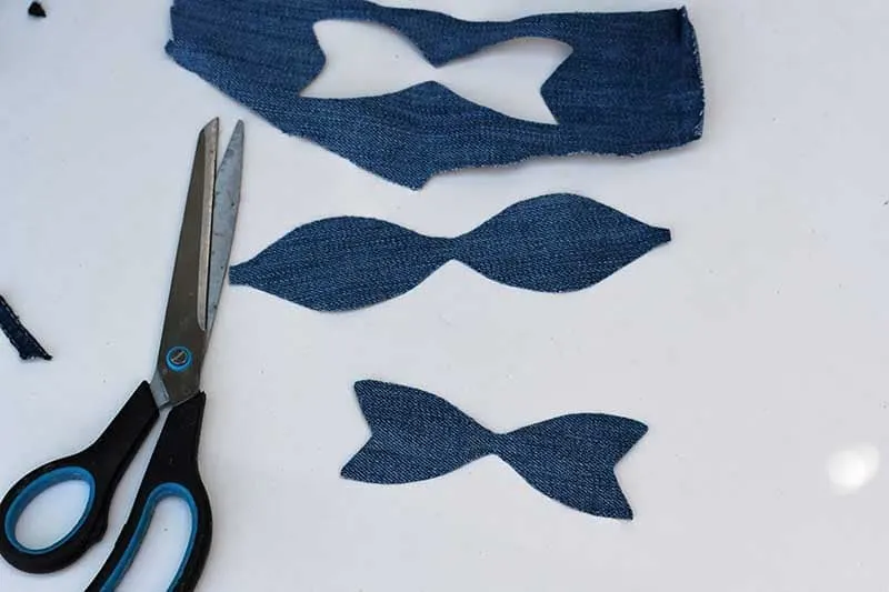 Cutting out denim bow shapes