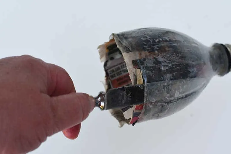 Removing paper mache tea cup out of the bottle top