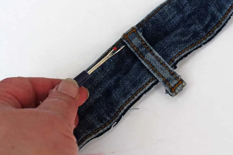 unpicking belt loop from a waistband