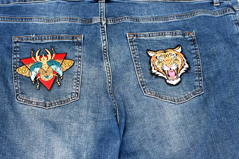 Adding patches to jeans.