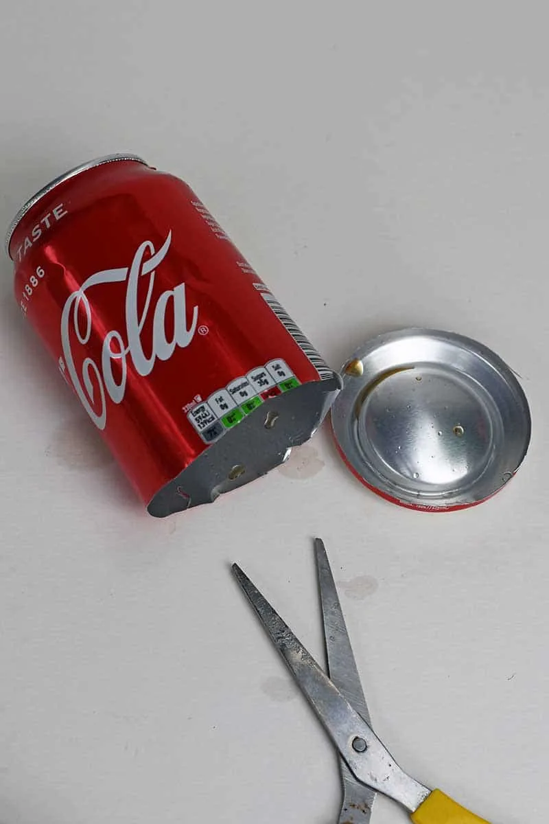 Cutting the base off a soda can